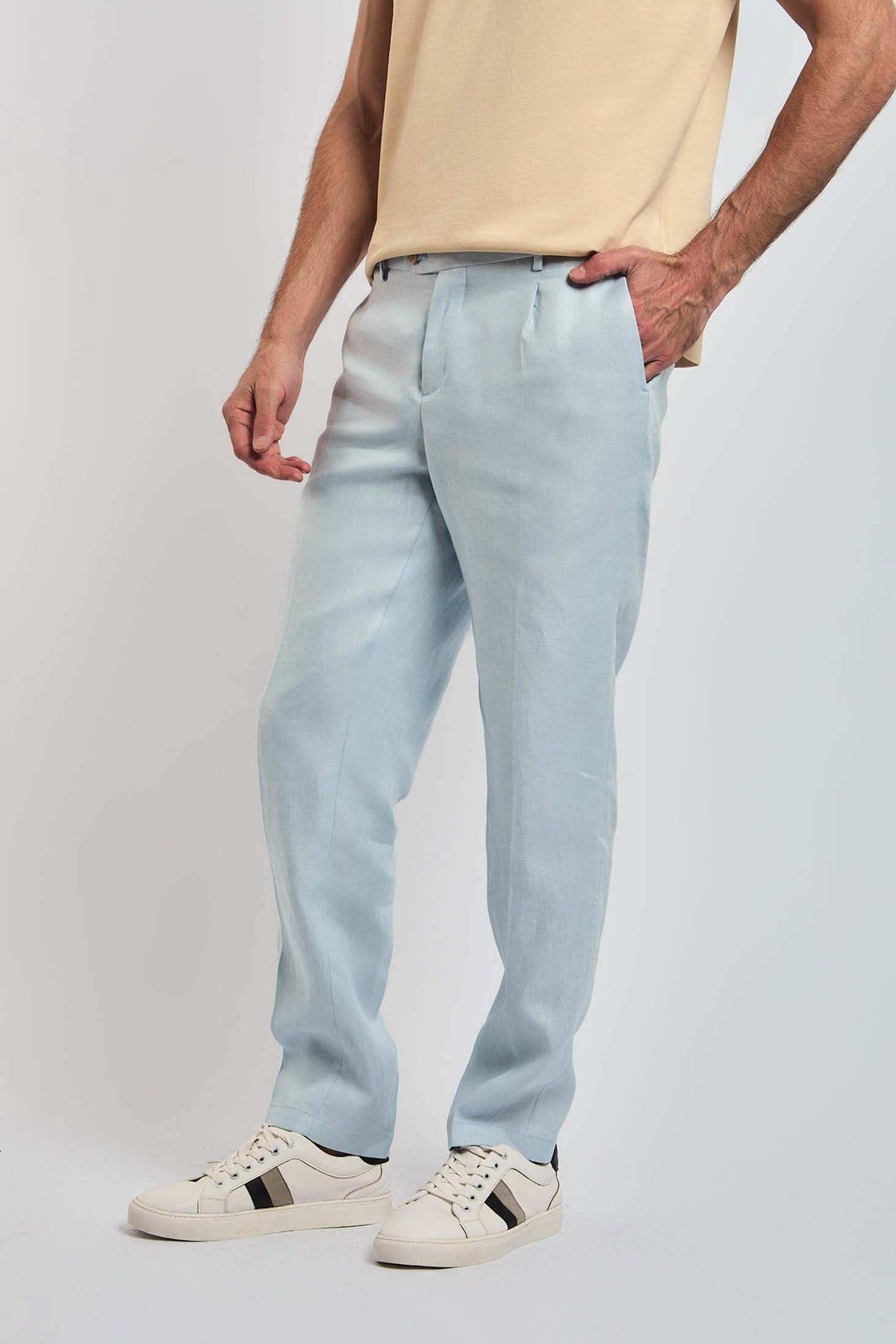 Dalydress men's light blue trousers styled with a beige top and white sneakers
