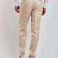 Dalydress beige men's trousers with back welt pockets, paired with a white shirt and sneakers