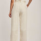 Dalydress women's high-waisted striped pants with belt, back view, beige top, neutral sandals