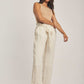 Dalydress women's fashion, model in beige sleeveless top and striped wide-leg pants