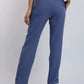 Dalydress women's blue tailored pants styled with a beige top and brown heels
