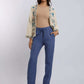 Woman wearing beige top, embroidered cream jacket, blue pants, and heels, Dalydress fashion.