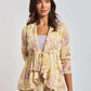Woman wearing Dalydress cream floral print dress with ruffle detail, fashion studio shot