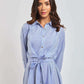 Woman wearing Dalydress blue striped shirt dress with waist tie, urban fashion style