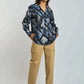 Woman wearing blue abstract print blouse and beige cargo pants, casual fashion look