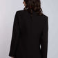 Woman in black blazer and pants, back view, formal women's fashion
