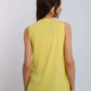 Woman wearing sleeveless yellow top and blue jeans, back view, casual fashion