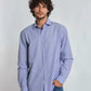 Man wearing Dalydress blue striped long sleeve shirt and jeans on white background
