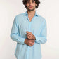Dalydress men's light blue dress shirt with beige trousers, model on white backdrop