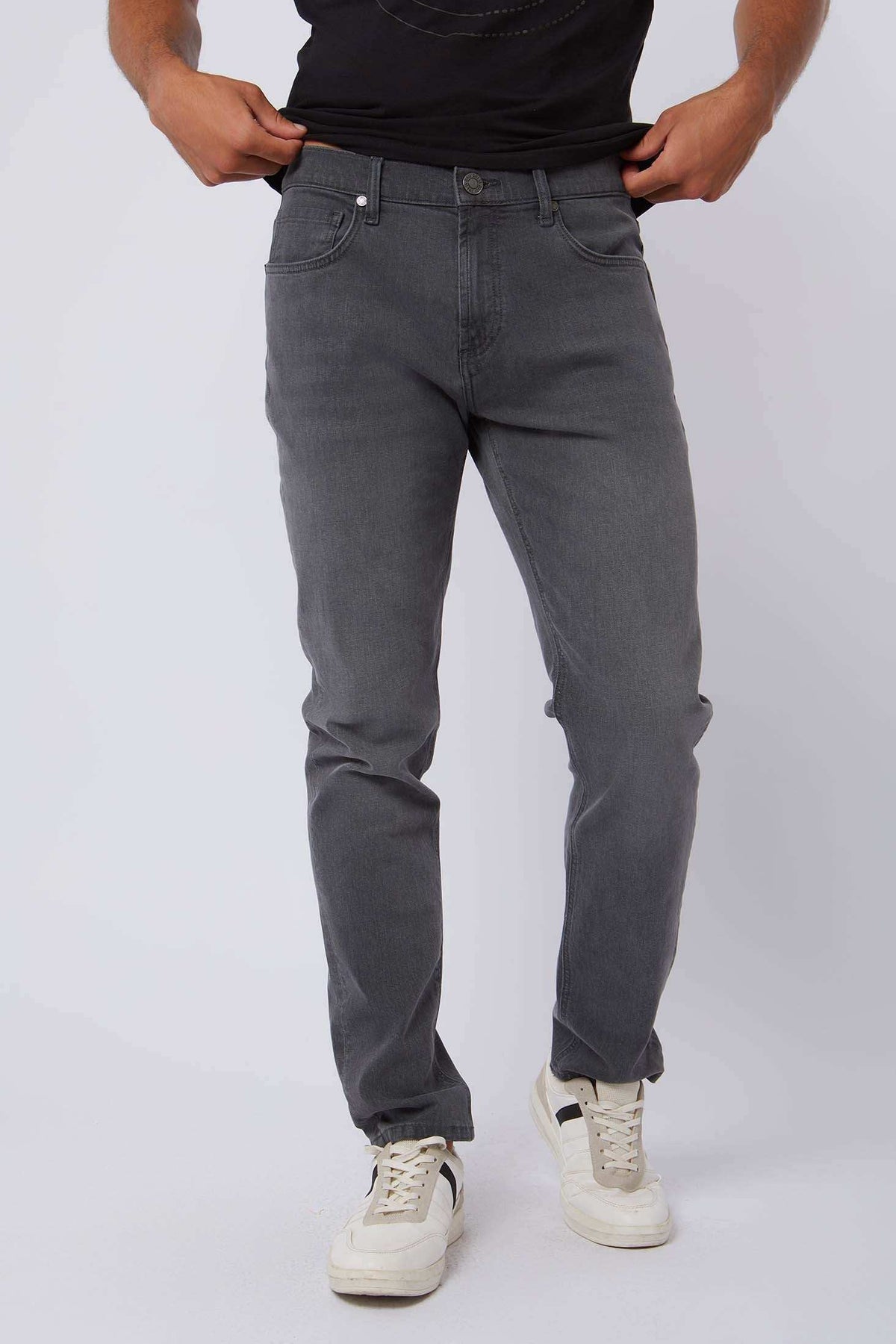 Dalydress men's grey jeans styled with white sneakers, casual urban fashion