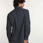 Dalydress men’s navy blue polka dot shirt with long sleeves and blue jeans, back view