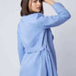 Woman in light blue belted blazer and pants set, back view, casual fashion look